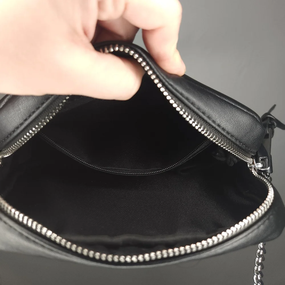 Rebecca Minkoff• Mini quilted studded black crossbody bag. 7.25” x 2.25” x 5.25”